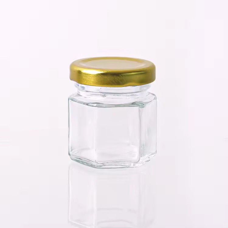 Προσαρμοσμένη ετικέτα Έξαγωνο σχήμα 100ml 180ml 380ml Γυάλινο βάζο με μέλι για μαρμελάδα ελαιοειδών