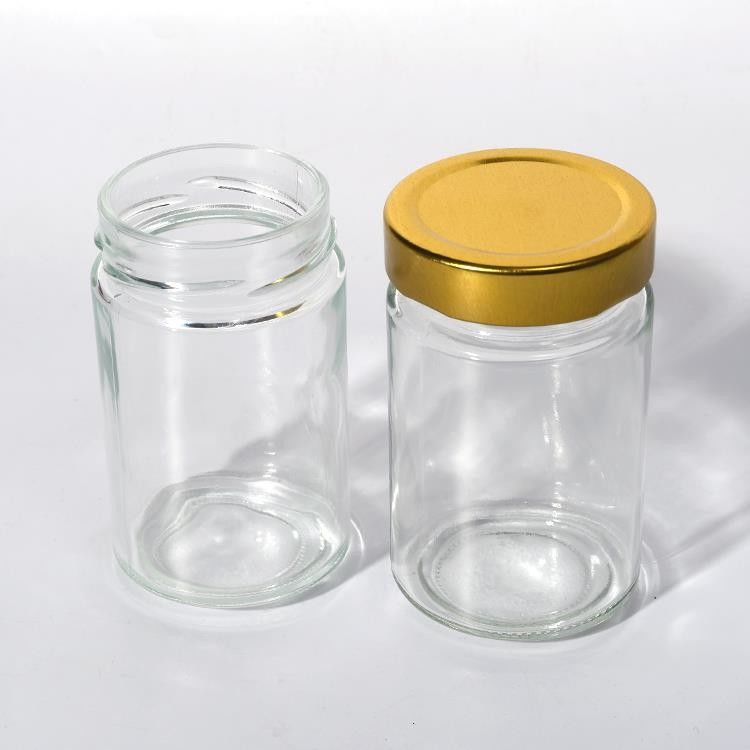 Χρήση σε εργοστάσια τροφίμων 1oz 4oz 8oz Στρογγυλό σχήμα Διαυγές κενό δοχείο αποθήκευσης γυαλί ζελετί μαρμελάδα μέλι σάλτσα βάζο